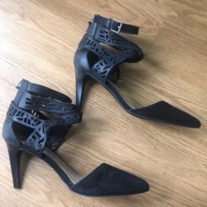 Black heels with detailed cut out leather.